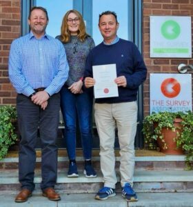 CICES Membership Manager, Serena Egerton, and Dean Edwards Divisional Manager at Midkent College Training Services, in his role as a CICES external auditor, present Alan Mansell with The Survey School’s Certificate of Approval